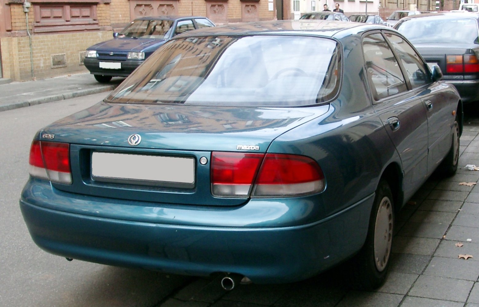 Classic sedan rear with distinct taillights and curved trunk design