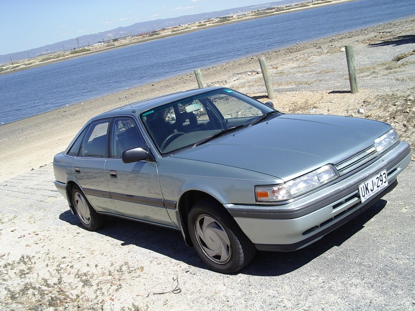 1987 vintage sedan with aerodynamic compact design and classic styling
