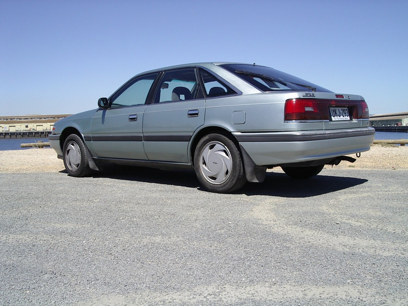 rear side profile with hatchback design and alloy wheels