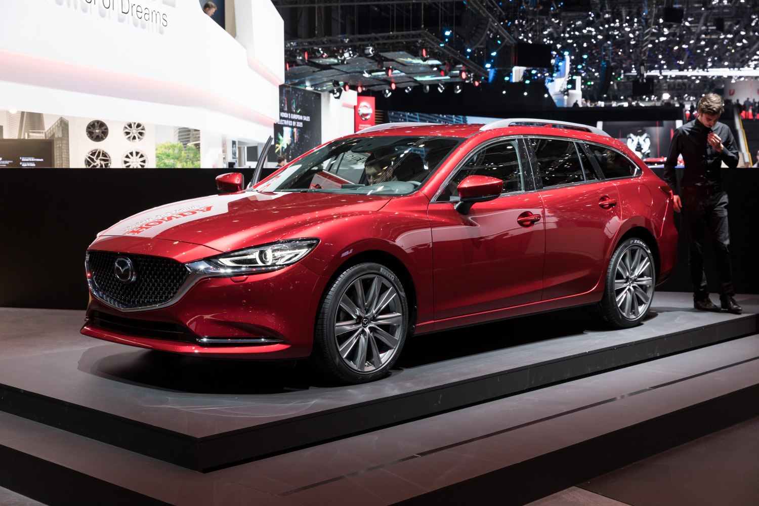 Red station wagon with dynamic design and alloy wheels