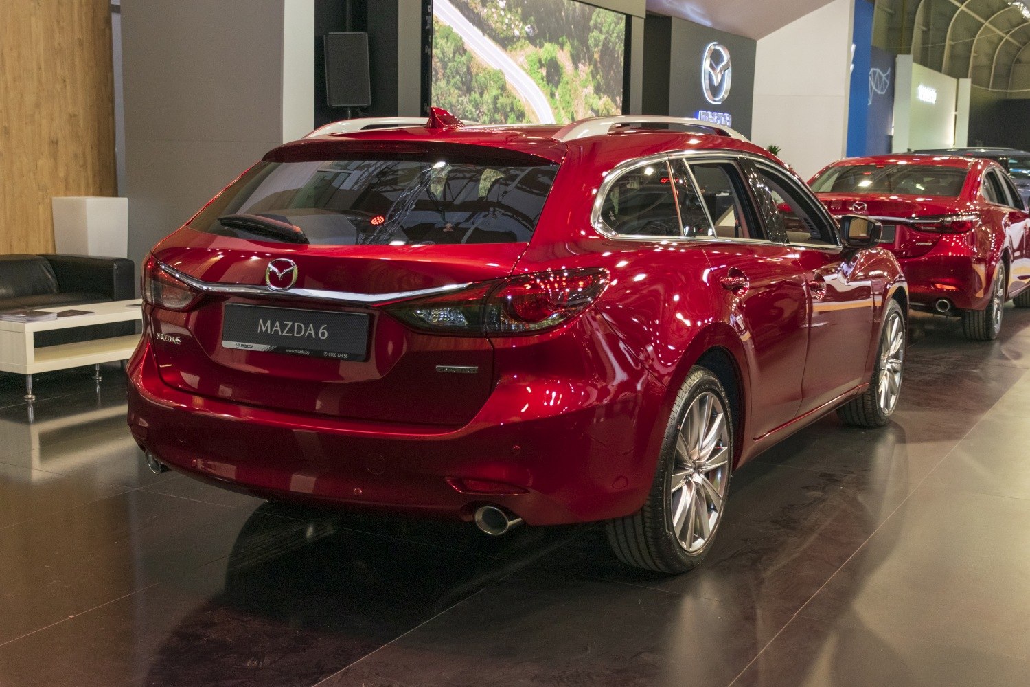 Red station wagon rear with dual exhaust and chrome trim