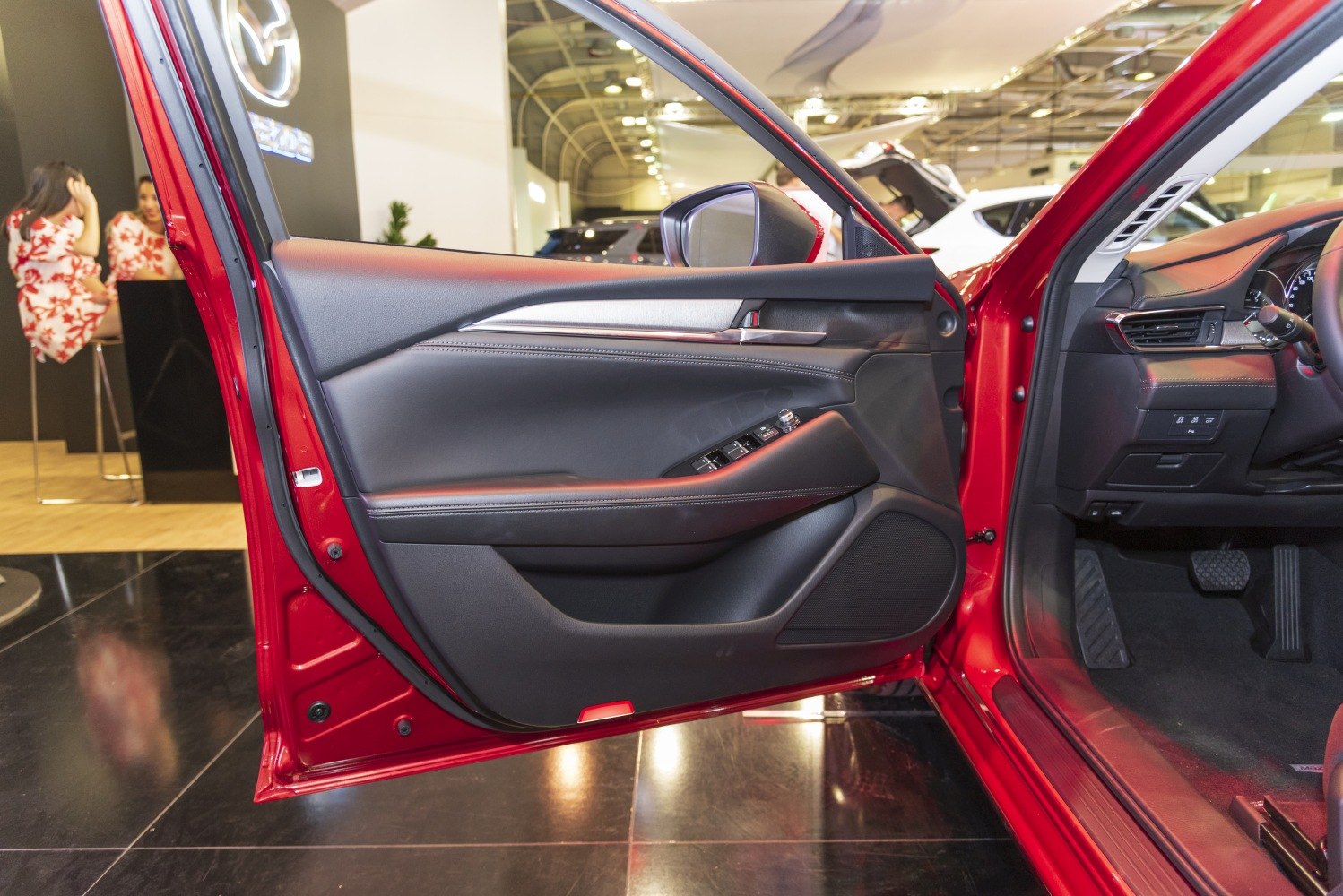Driver side interior door panel with controls and trim details