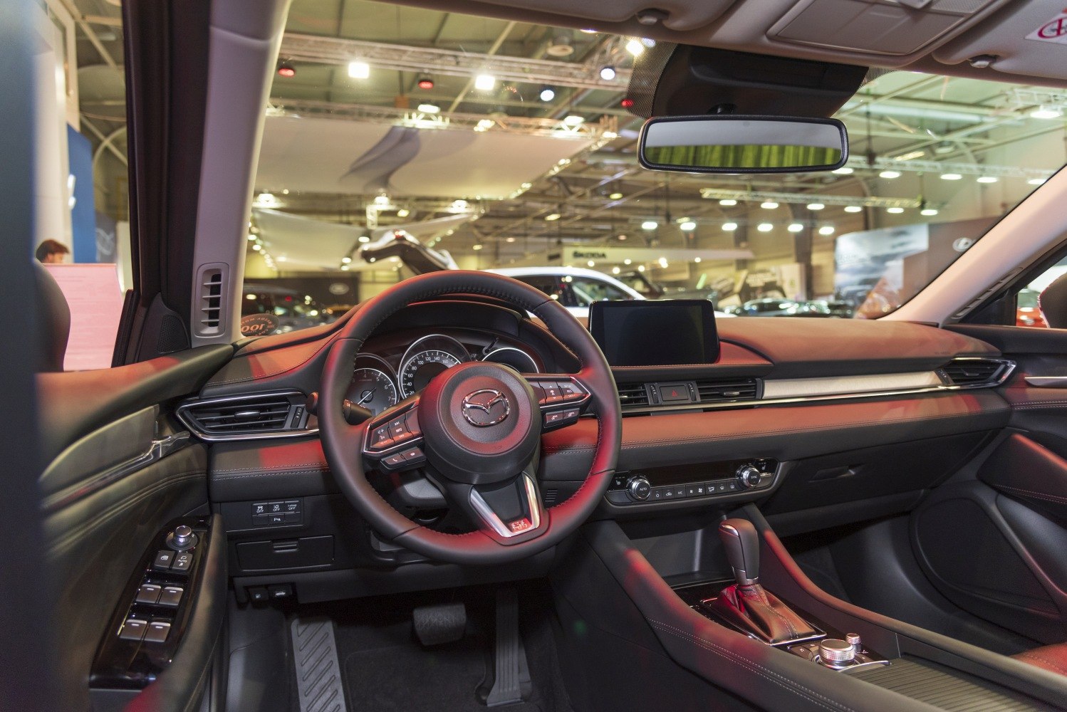 Dashboard and steering wheel with infotainment screen and console controls