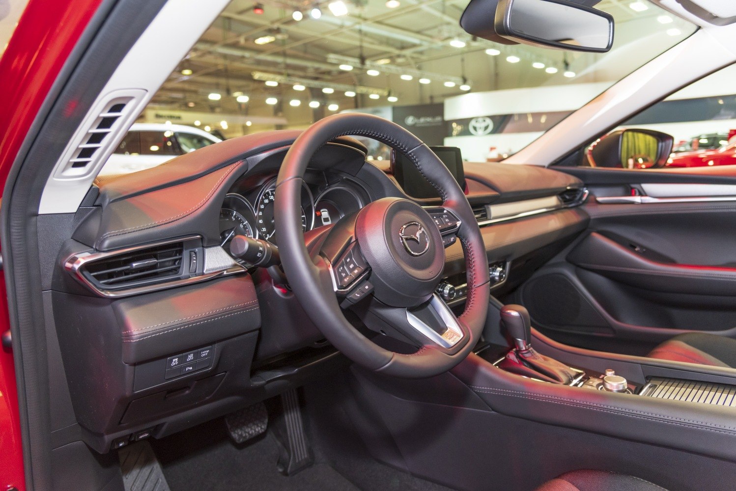 Modern car interior dashboard and steering wheel with gear shift