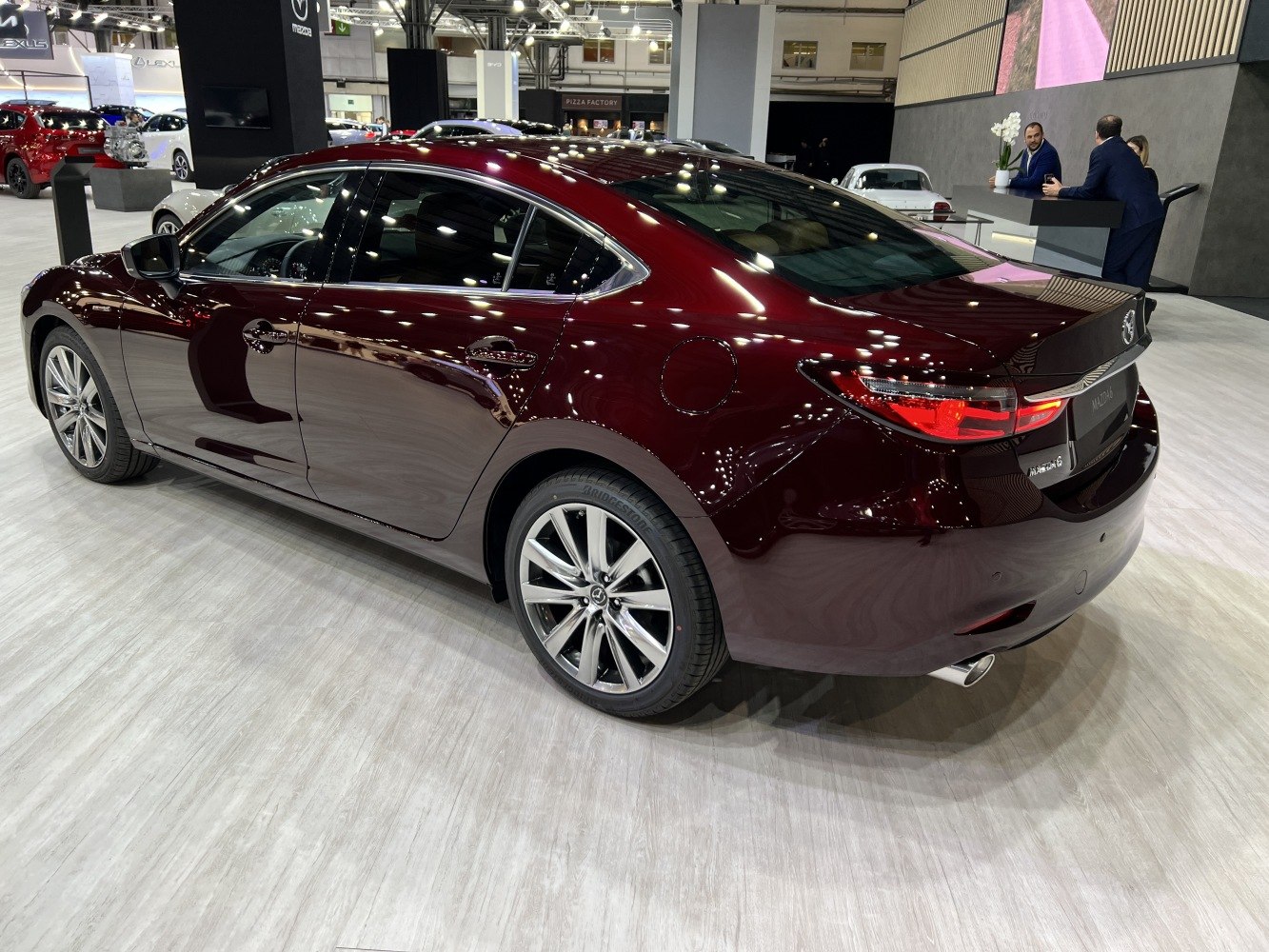 Rear side view showing sleek tail lights and alloy wheels