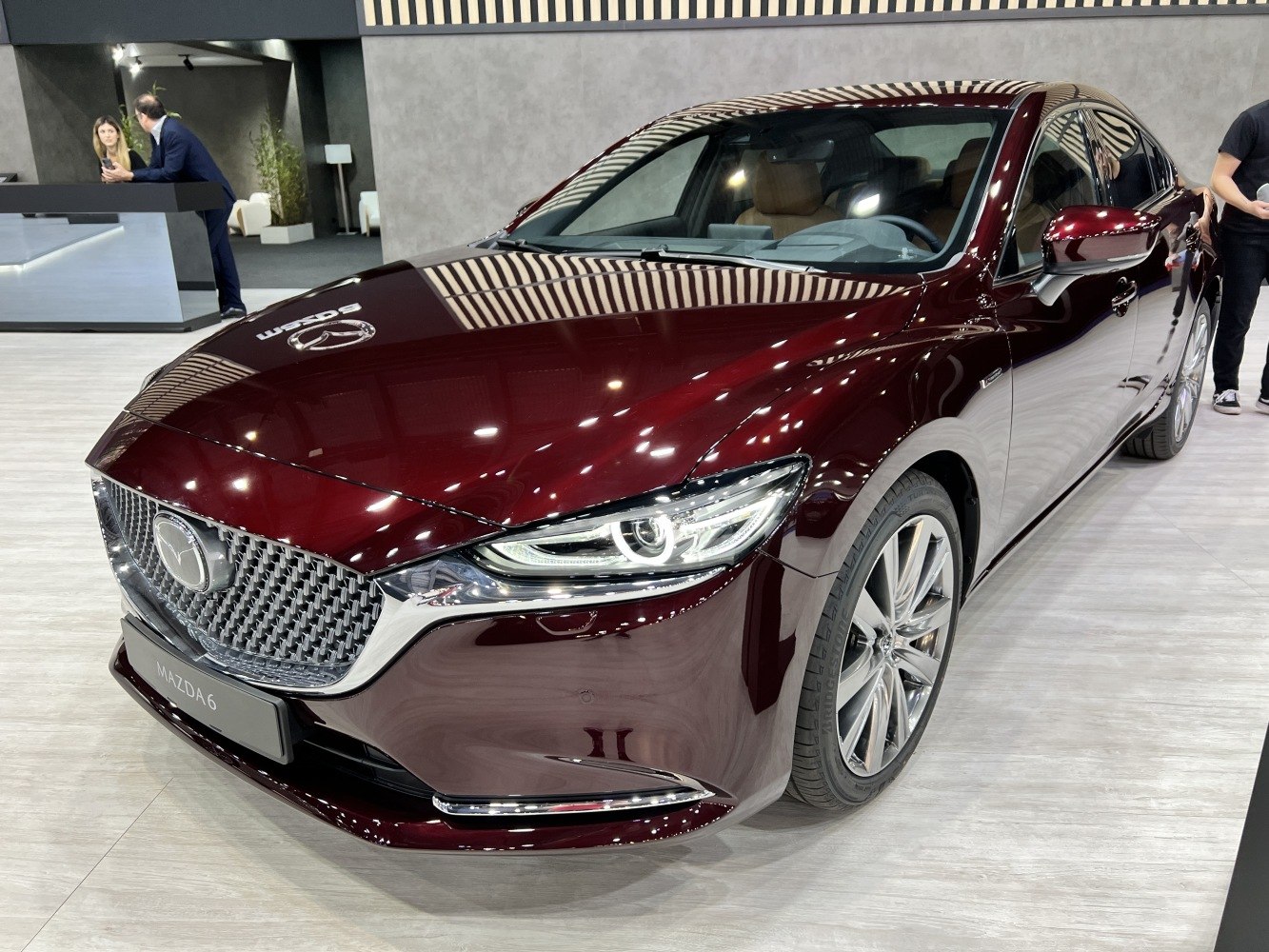 Sleek front grille and sharp LED headlights of a modern sedan
