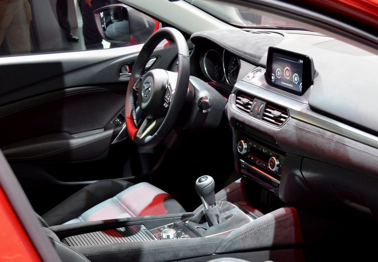Manual transmission gearshift and infotainment display with modern dashboard