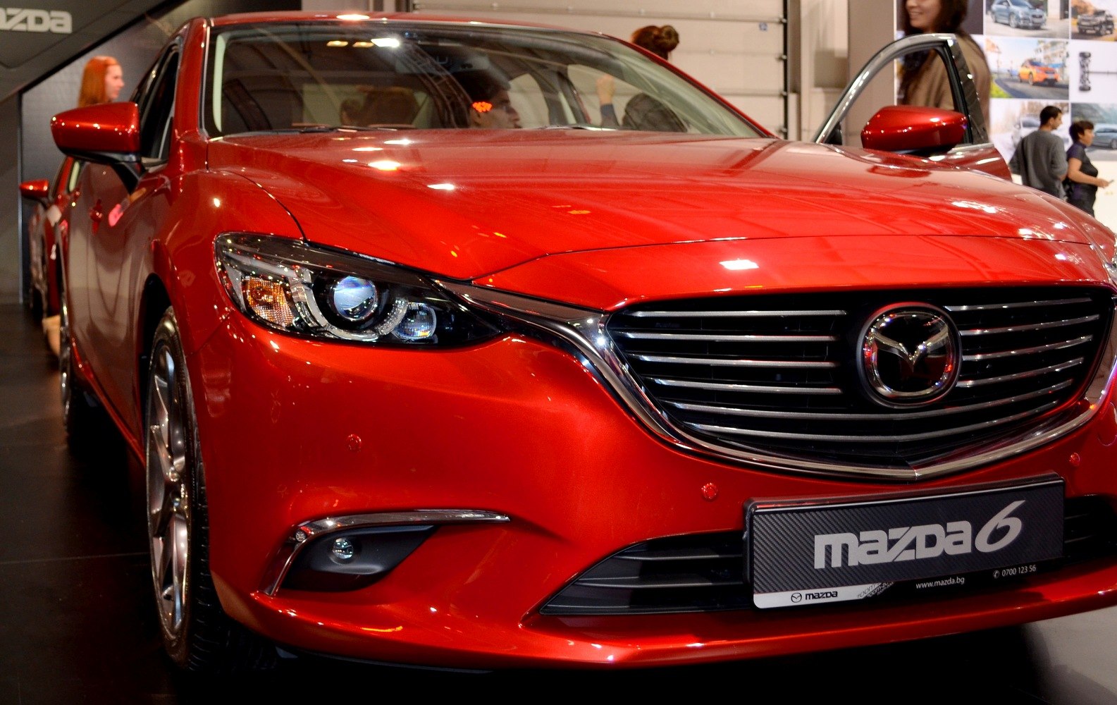 Close-up of front grille and LED headlights of a modern sedan