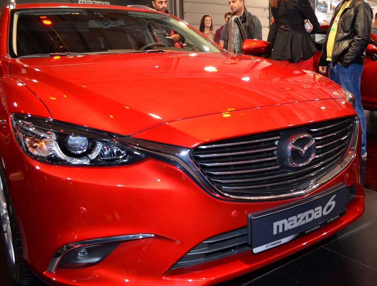 Close-up of bold front grille and sleek headlight with LED elements