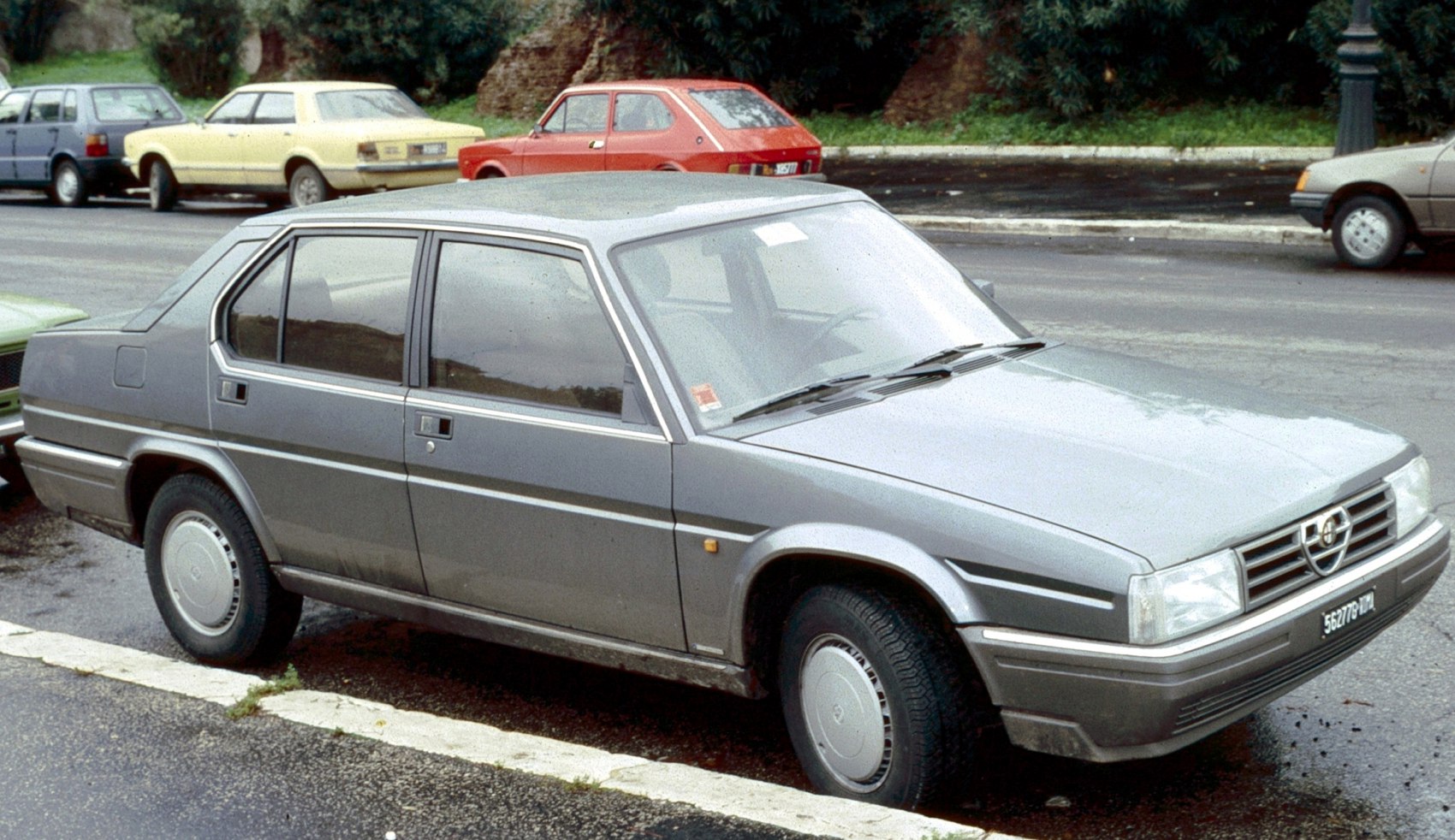 Side profile of vintage 1980s sedan with boxy, angular design