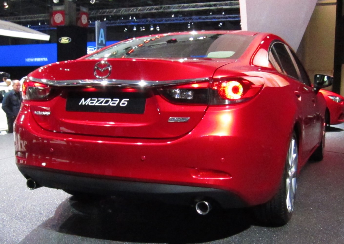 rear view with signature taillights and dual exhaust pipes