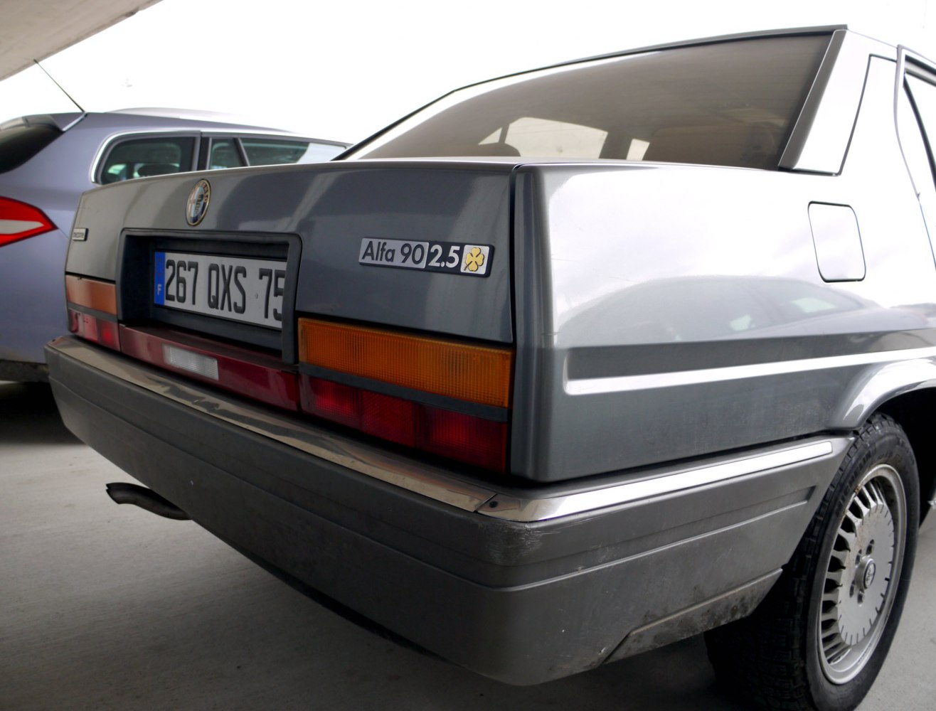 Rear view highlighting badge, tail lights, and angular rear design