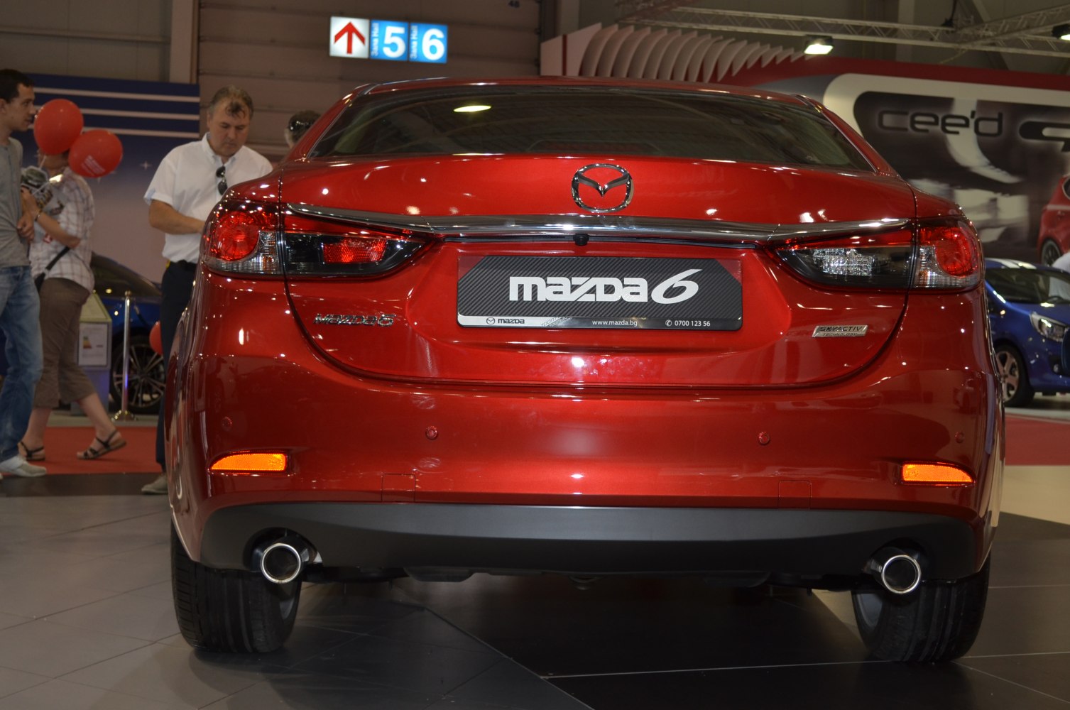 Rear view showing dual exhaust and modern LED tail lights with chrome trim