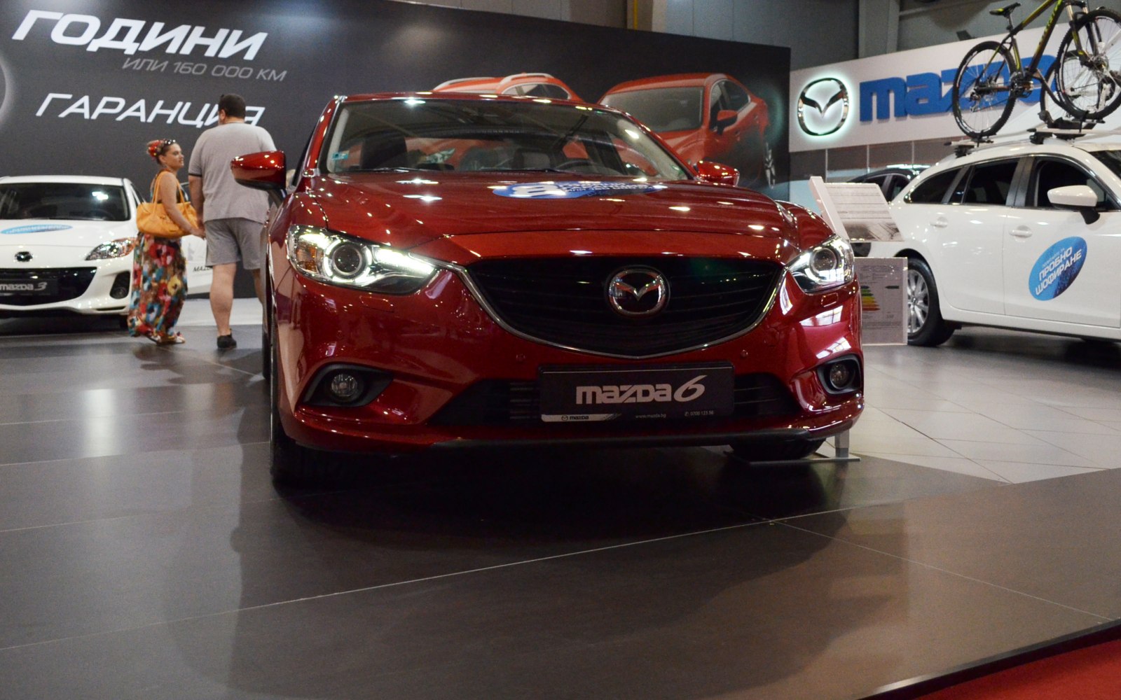 Front view showcasing headlights and grille of a sedan