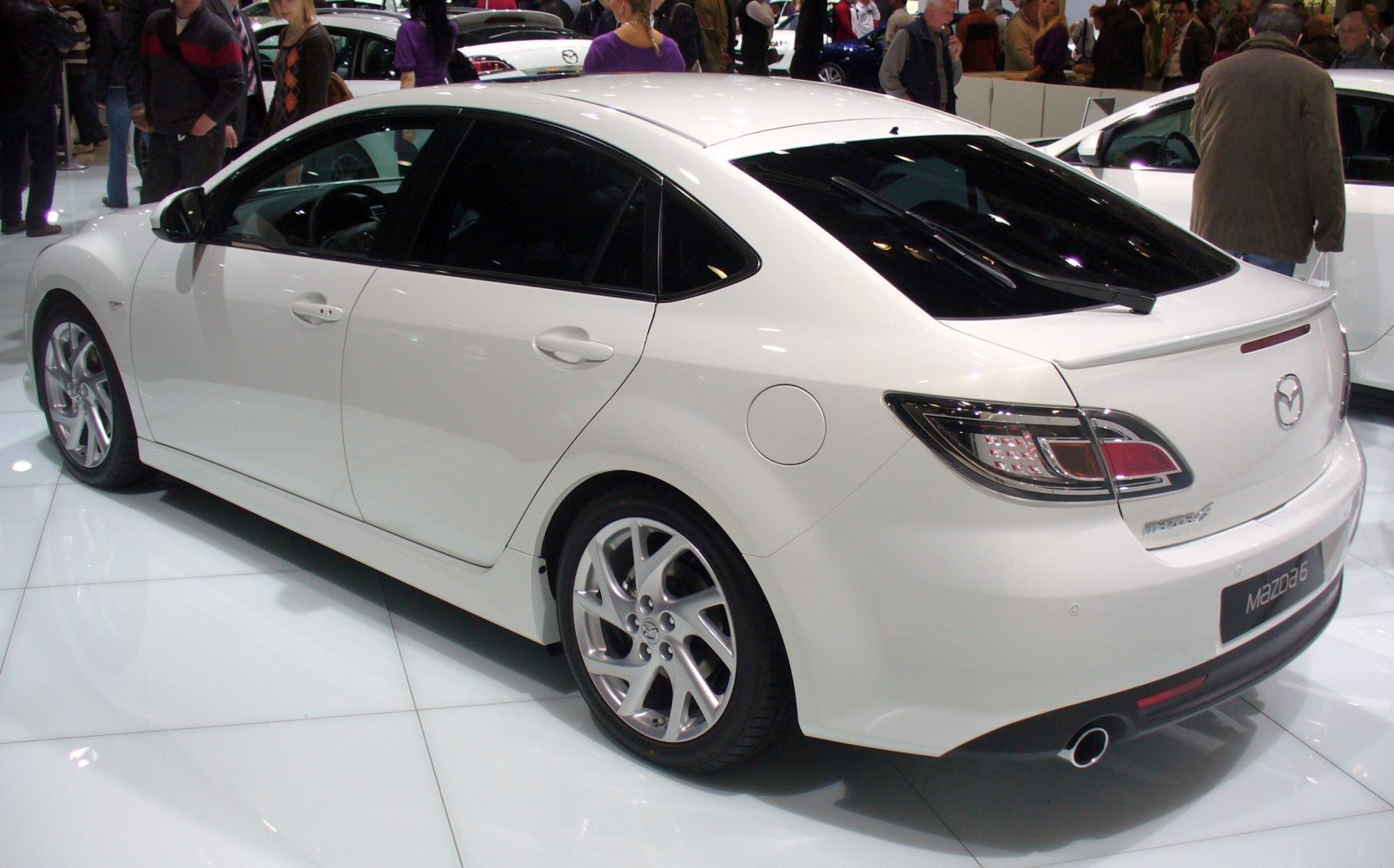 Rear and side view of hatchback with alloy wheels and distinct taillights