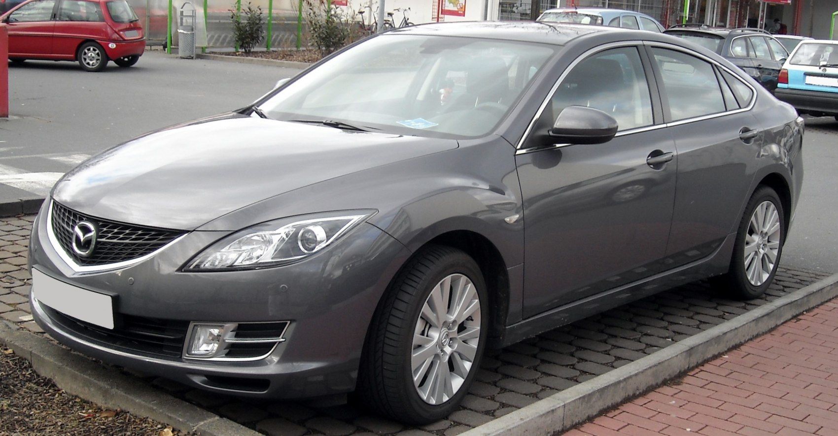 Sleek front-side view of a mid-size hatchback with alloy wheels