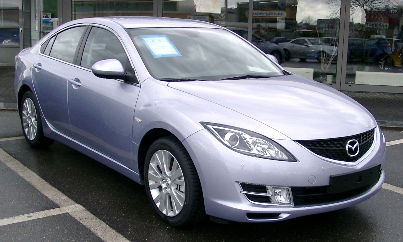 Sleek sedan with aerodynamic front and multi-spoke alloy wheels