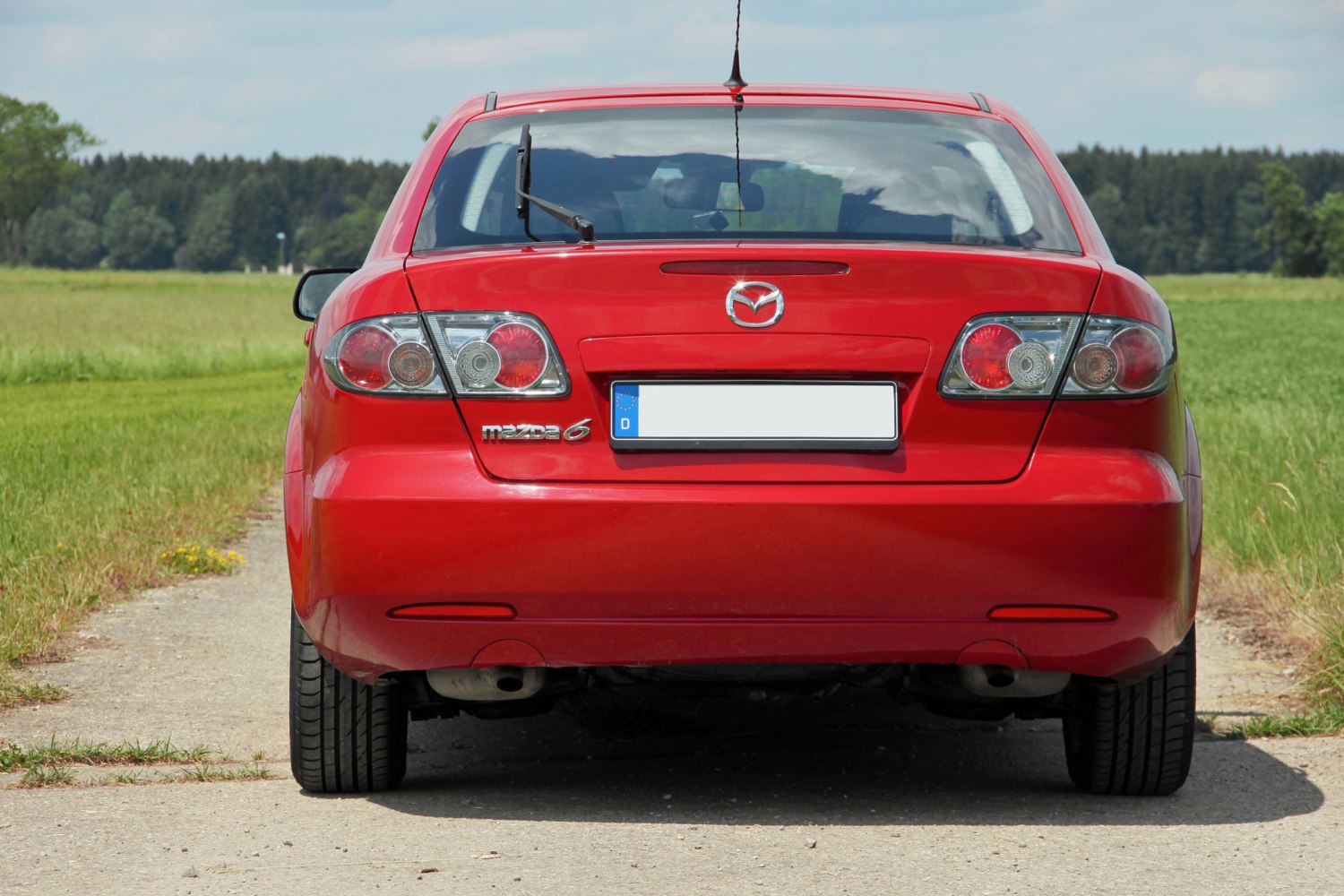 Rear view with tail lights and rear hatch of a hatchback