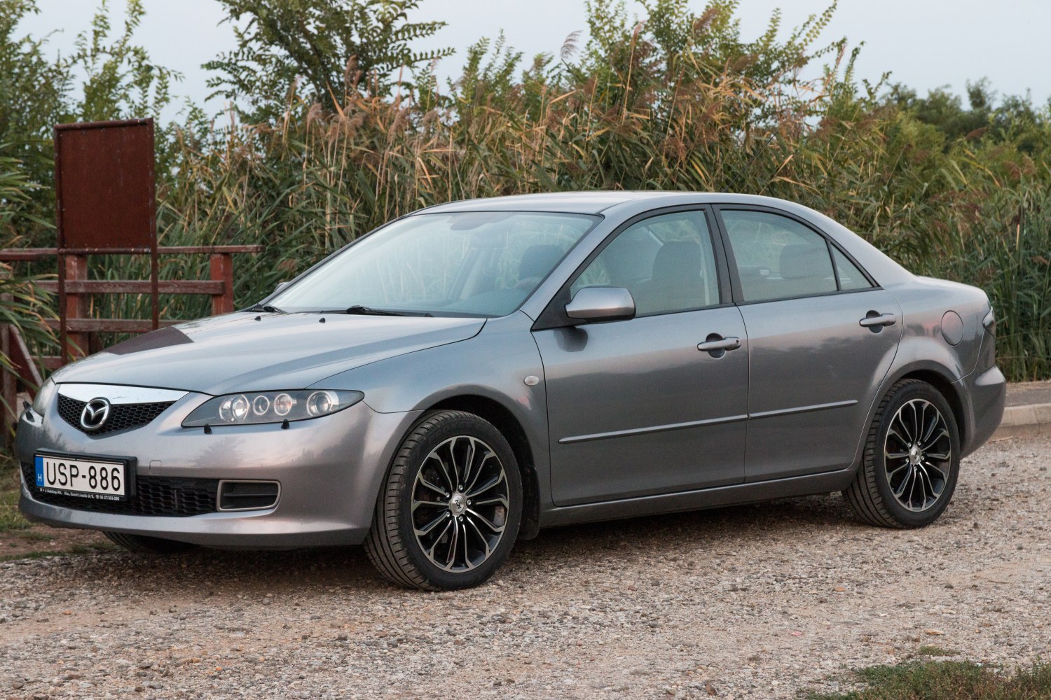 Sedan with multi-lens headlights and black alloy wheels