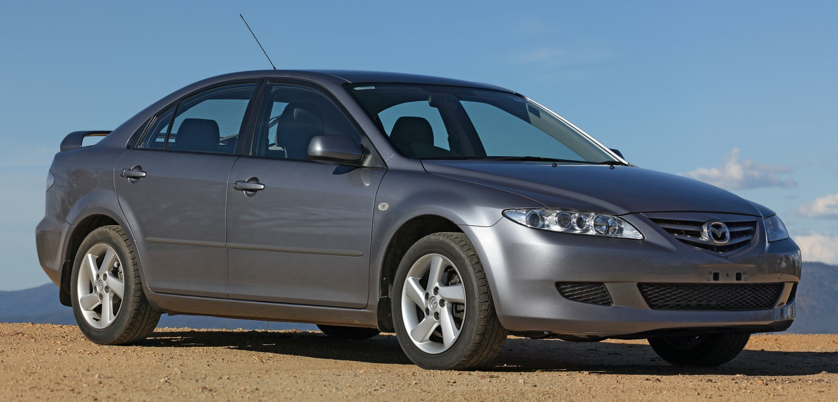 Side-front view of a hatchback with alloy wheels and aerodynamic styling
