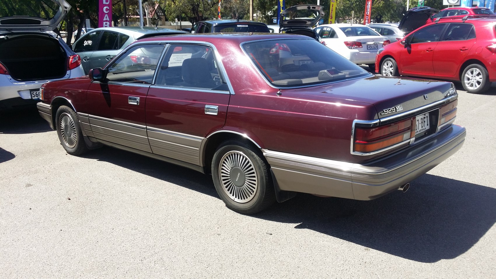 Vintage sedan with two-tone paint and retro wheels