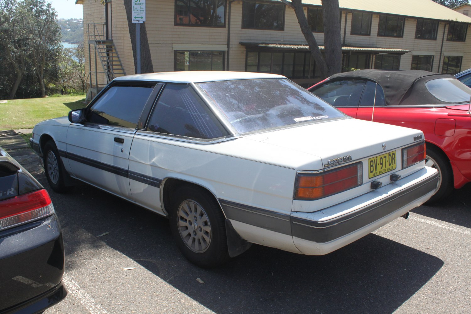 Angular 1980s coupe rear and side with large rear window