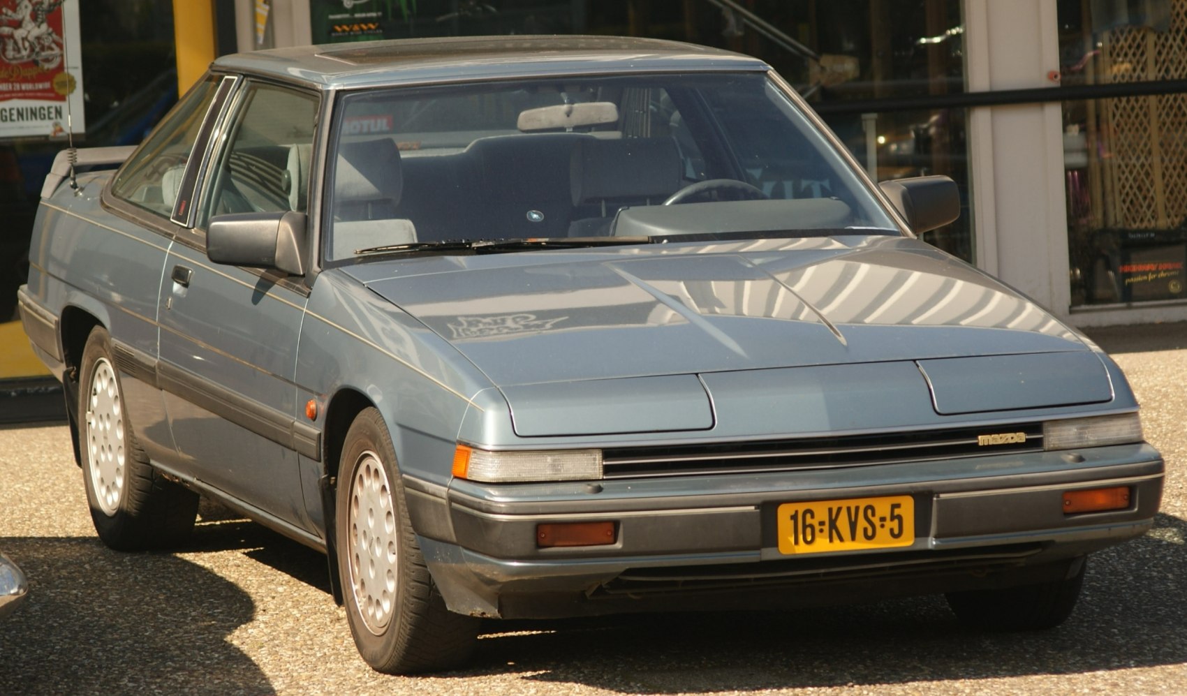 Two-door coupe with pop-up headlights and classic 1980s styling