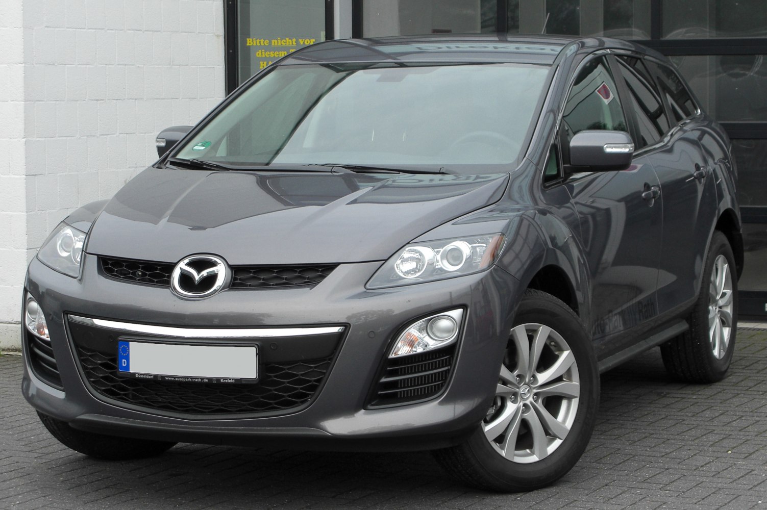 Front view with headlights, grille, and alloy wheels of a compact SUV