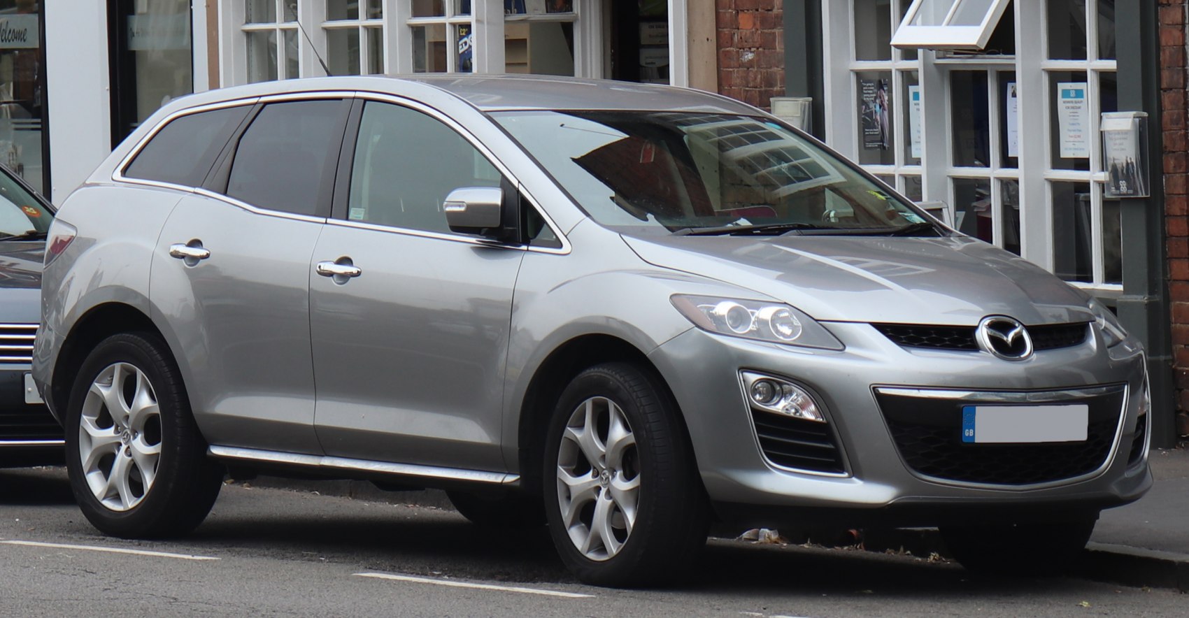 Silver compact SUV with alloy wheels, front side view
