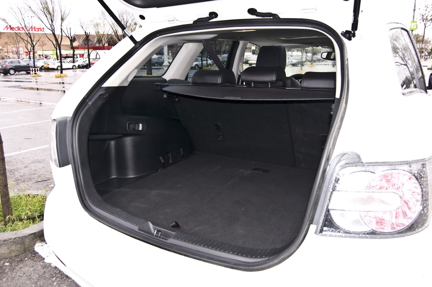 Spacious rear cargo area with retractable cover and rear seat headrests