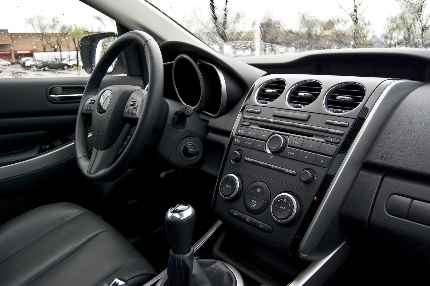 Dashboard and manual gearstick with climate control knobs