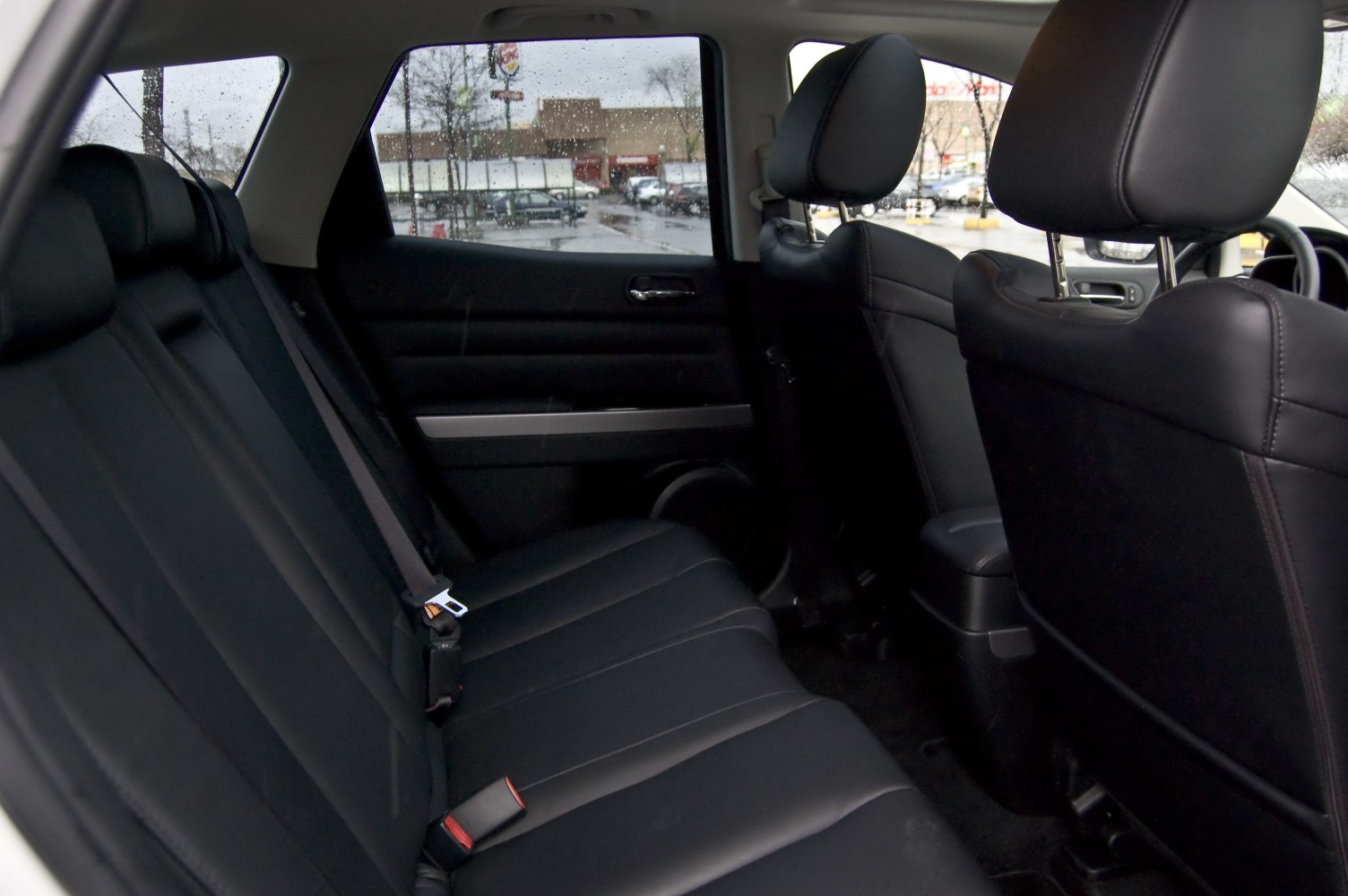 Black leather rear seats and spacious cabin with headrests
