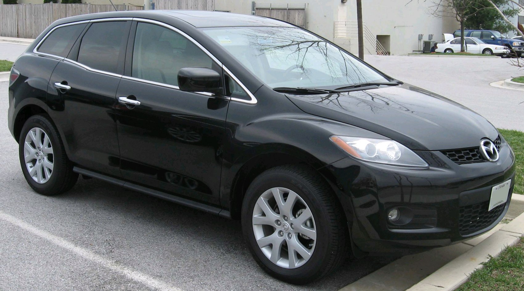 Front side exterior of a black compact SUV with alloy wheels