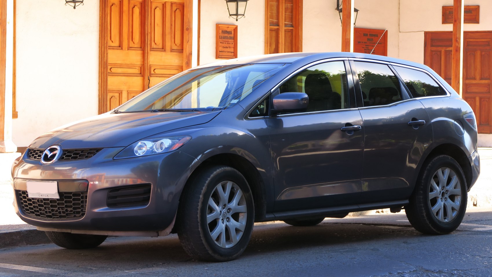 Front-side view of a compact SUV showing headlights, grille, and wheels