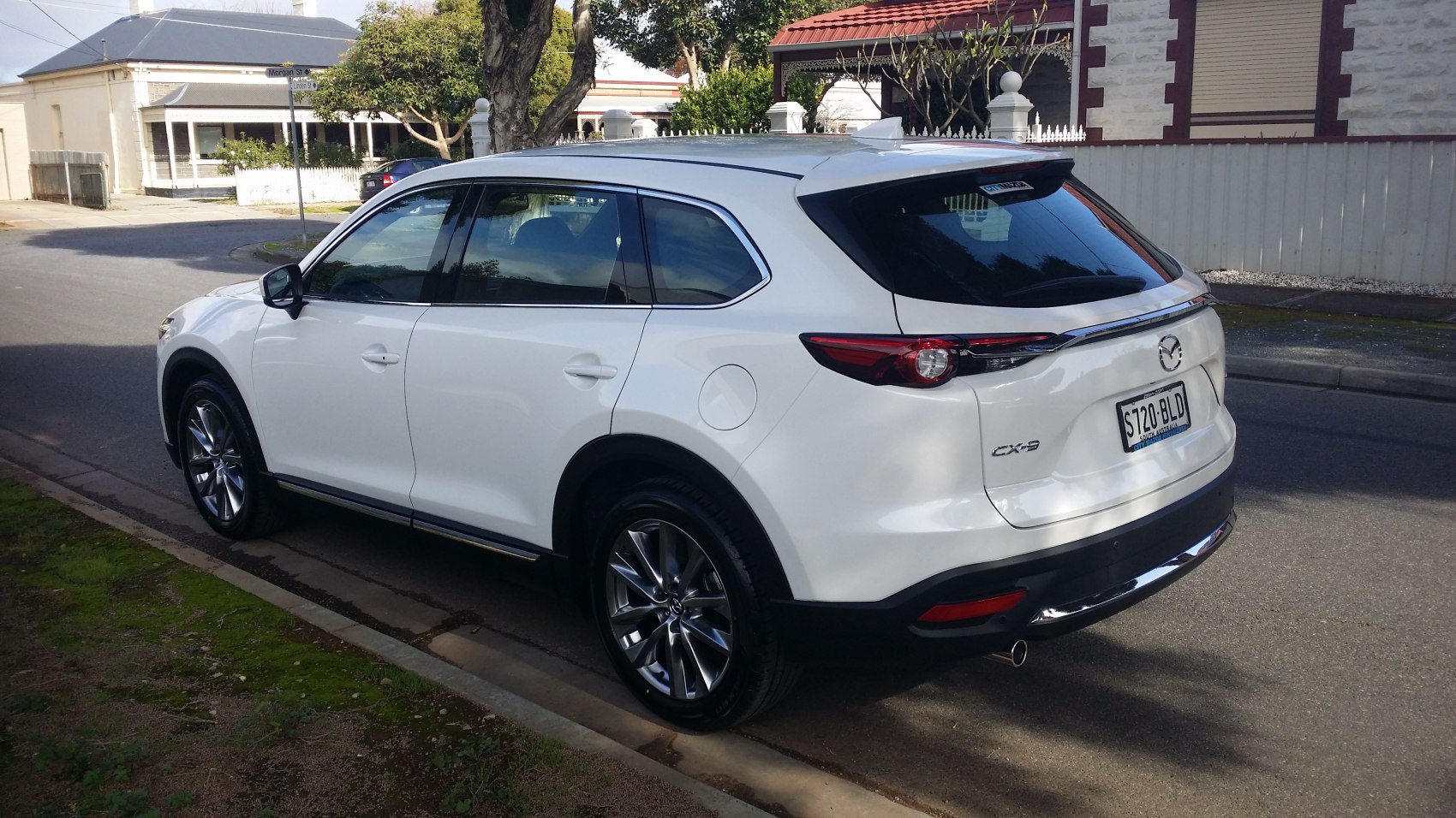 Rear-side view of an SUV with sleek LED tail lights and alloy wheels
