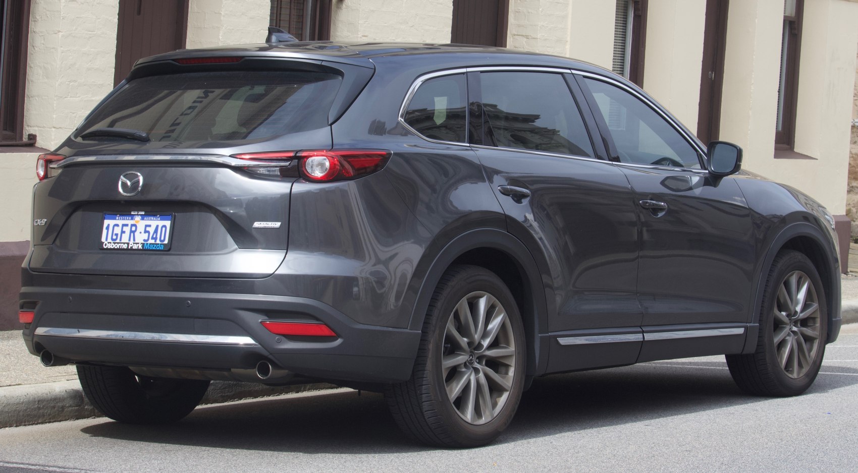 SUV rear and side view with dual exhaust and alloy wheels