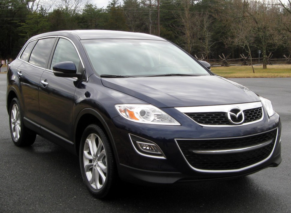 Front-side view of SUV with distinctive headlights and grille