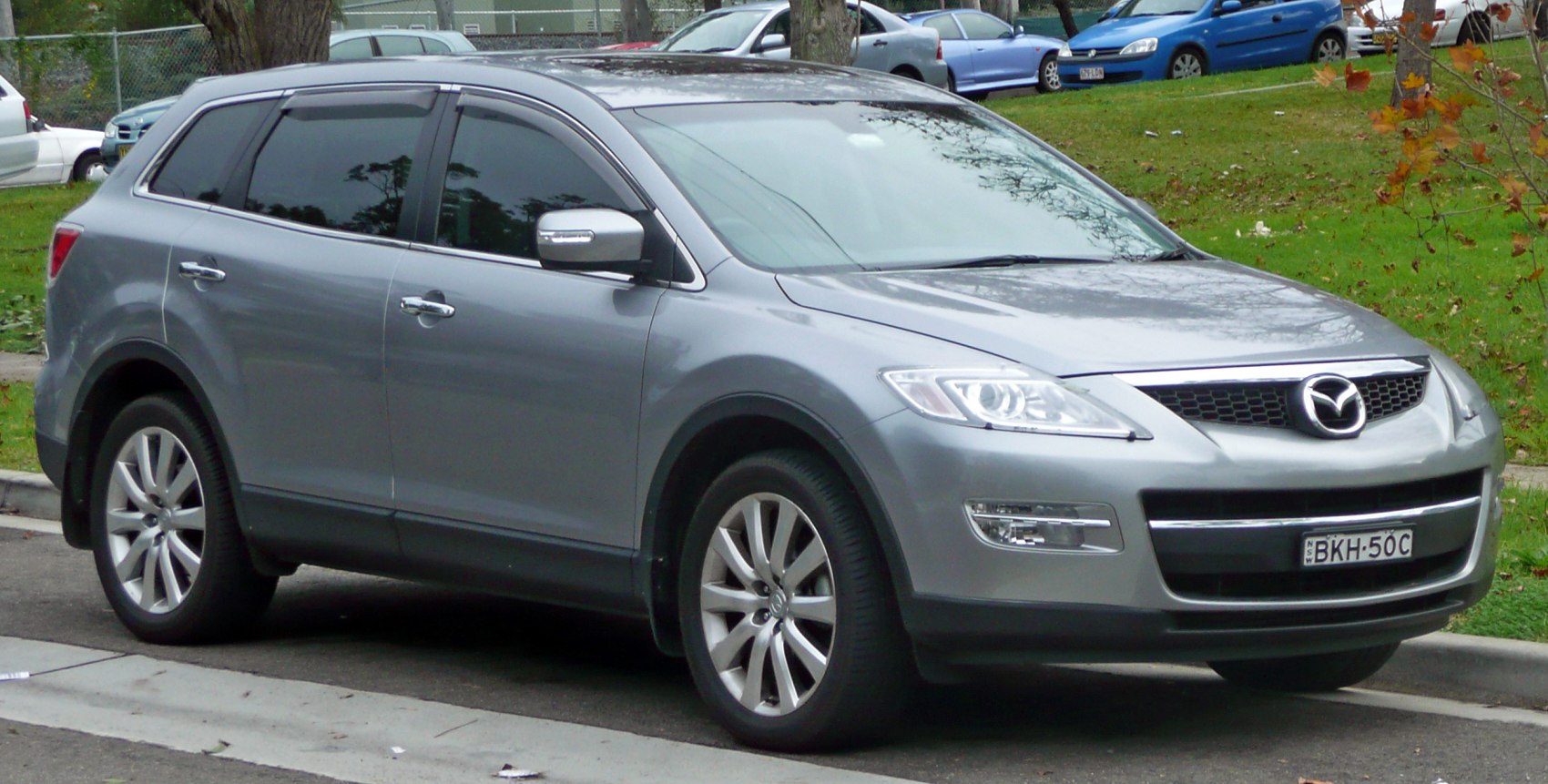 Front and side profile of grey SUV with alloy wheels and tinted windows