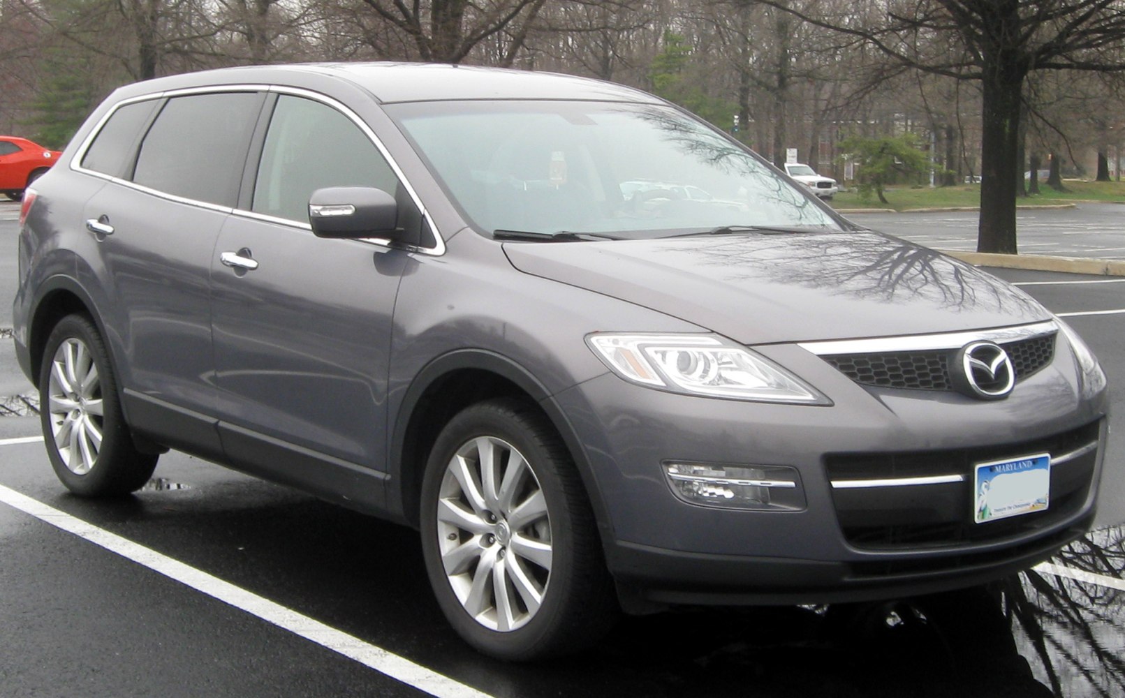 Front side profile of gray SUV with alloy wheels