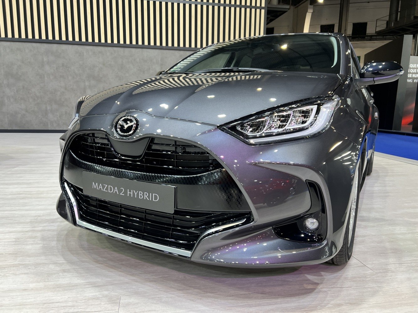 Front view showcasing sleek headlights and wide grille design