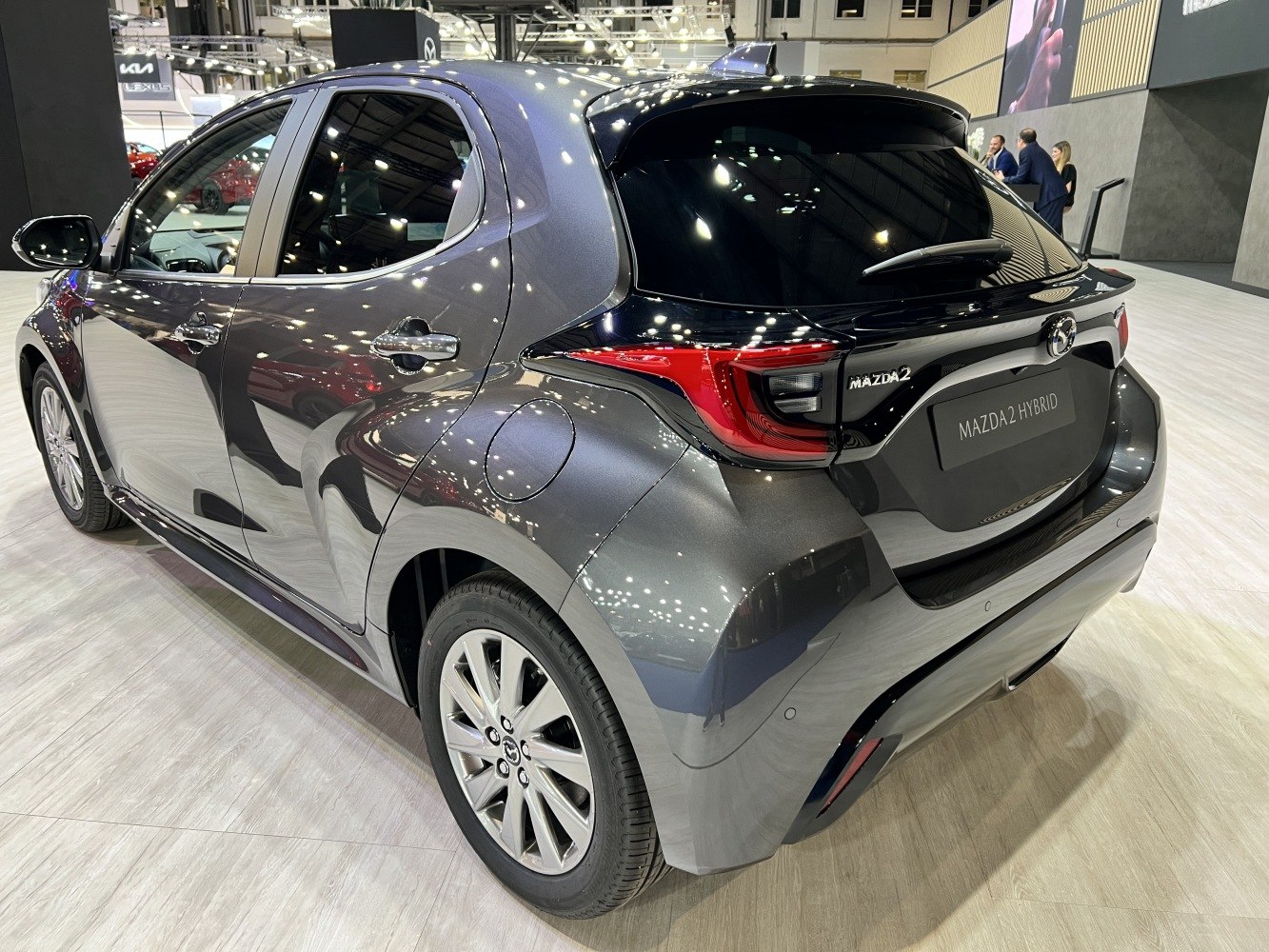 Rear and side view of compact hatchback with hybrid badging and modern taillights