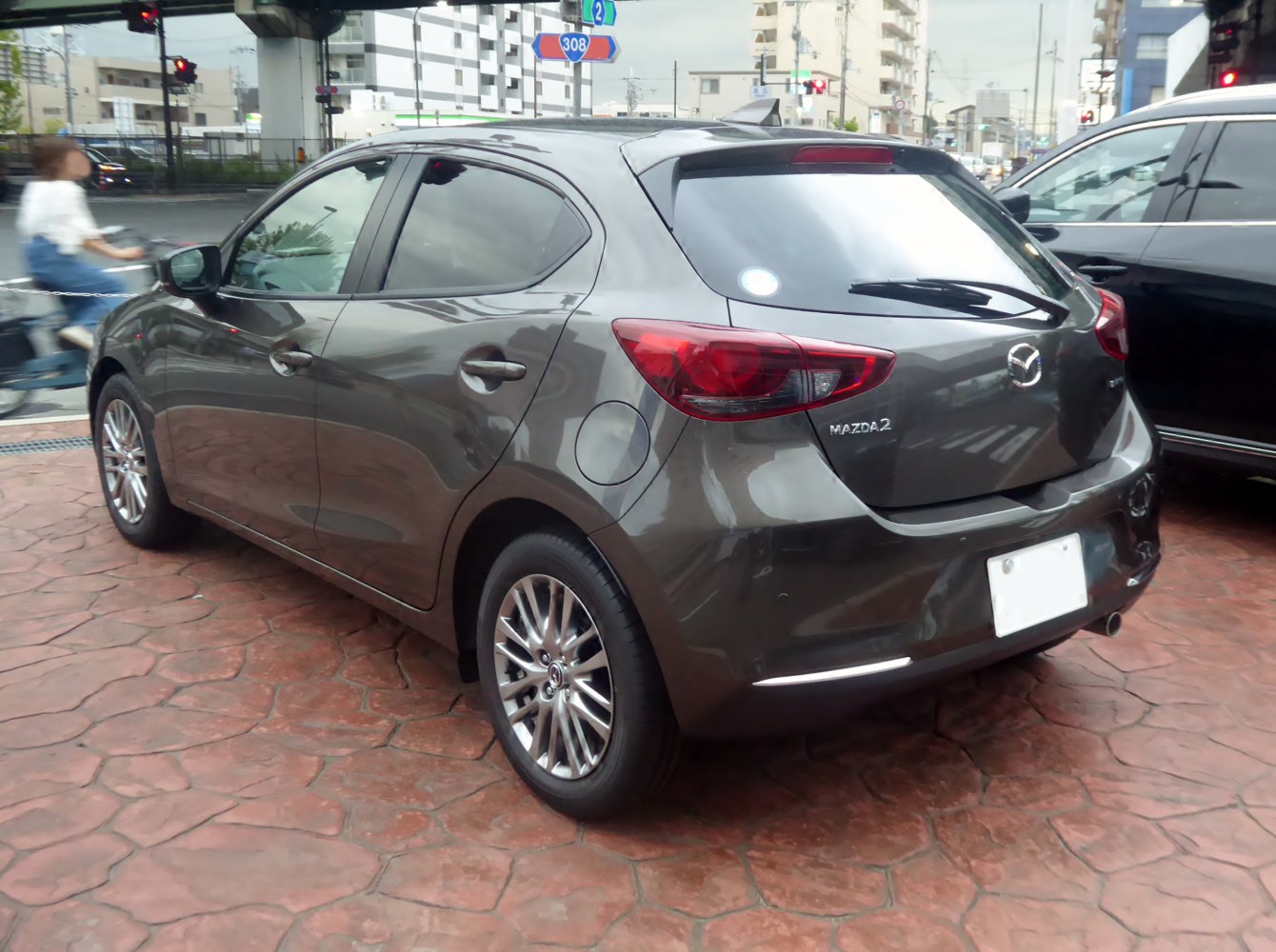 Rear-side view of a hatchback with alloy wheels and tinted windows