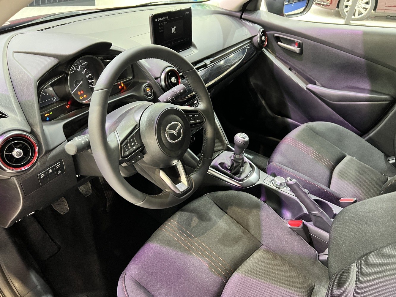 Manual transmission and dashboard with infotainment screen