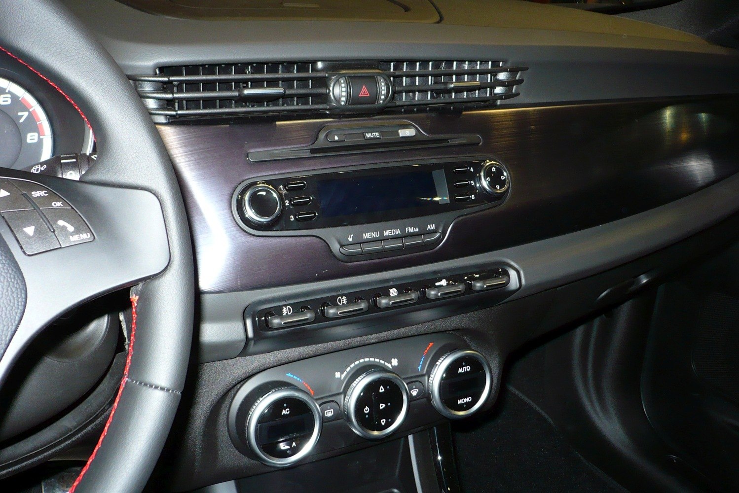 Dashboard and climate control panel with steering wheel and infotainment system