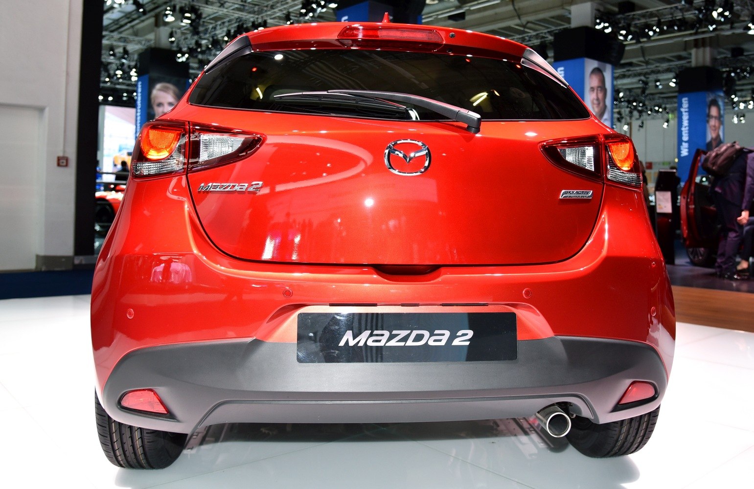 Rear view with tail lights, rear windshield wiper, and exhaust pipe
