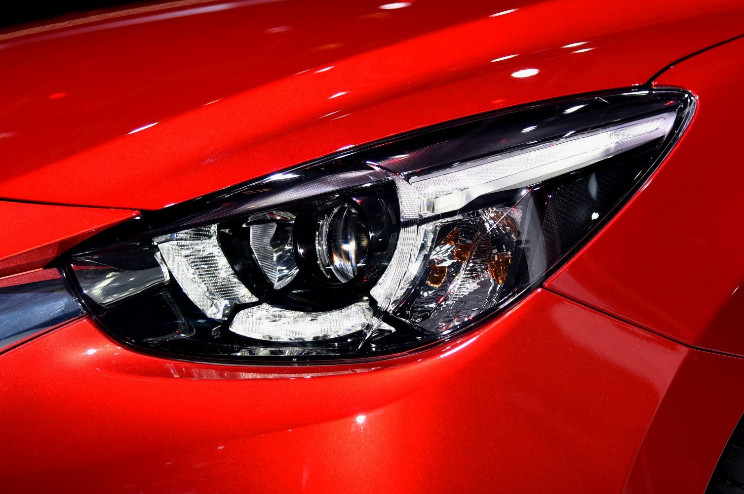 Close-up of a modern LED headlight with complex lighting elements