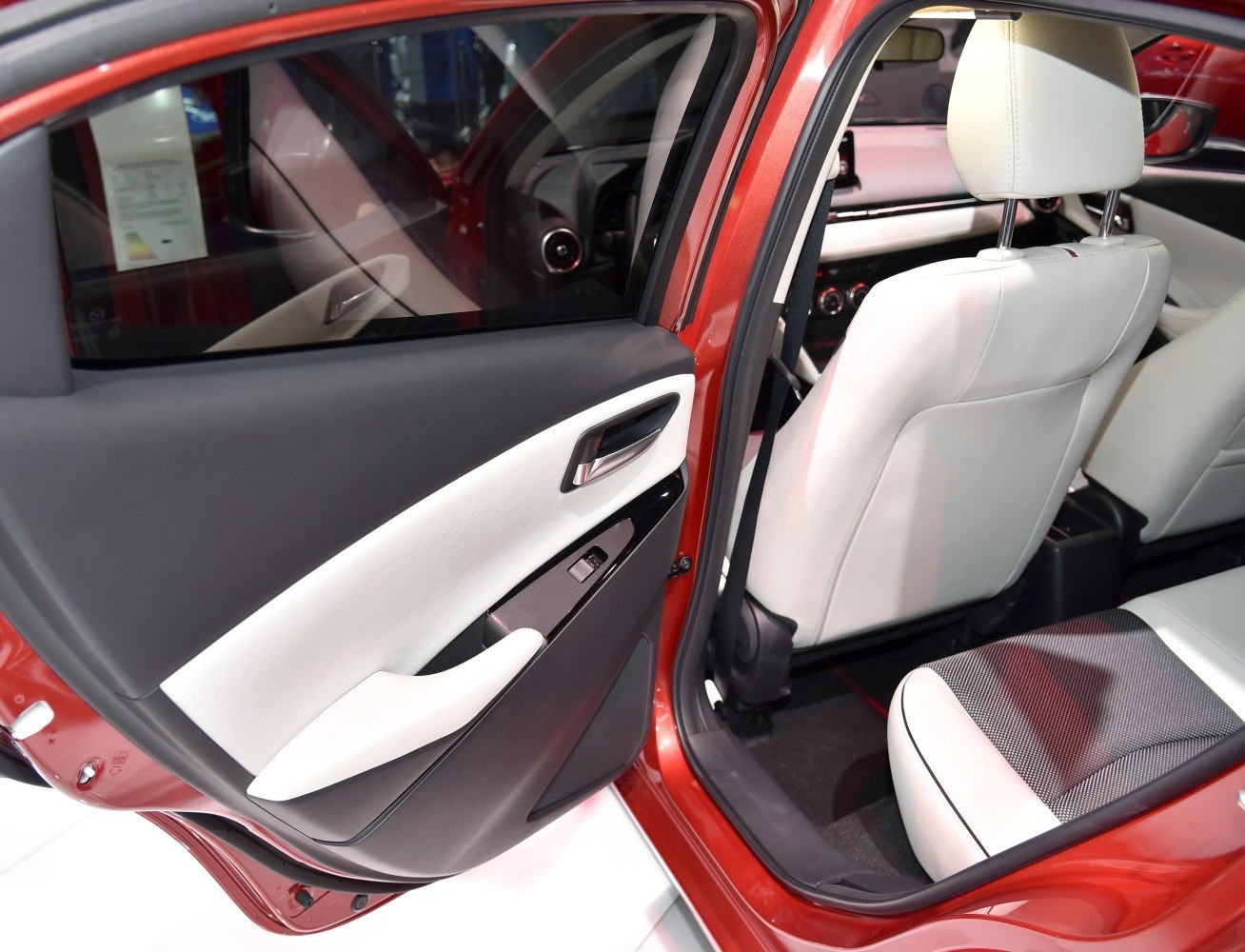 Rear door panel and light-colored seat interior design.