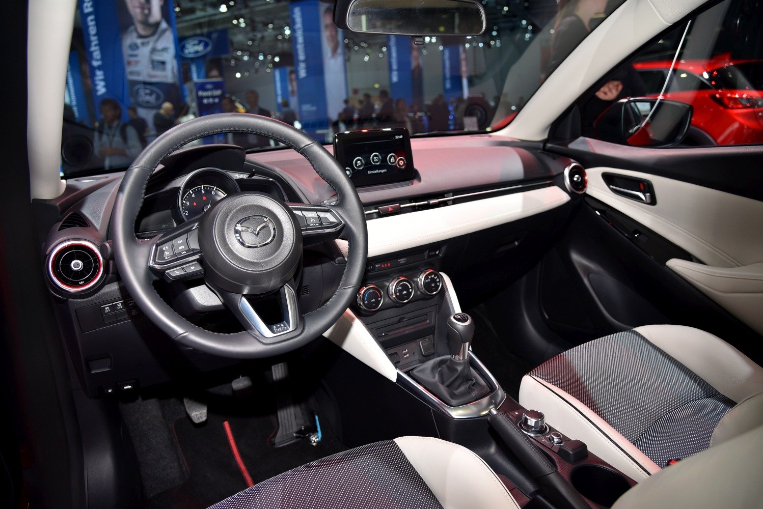 Dashboard, steering wheel, infotainment screen, manual gear shift