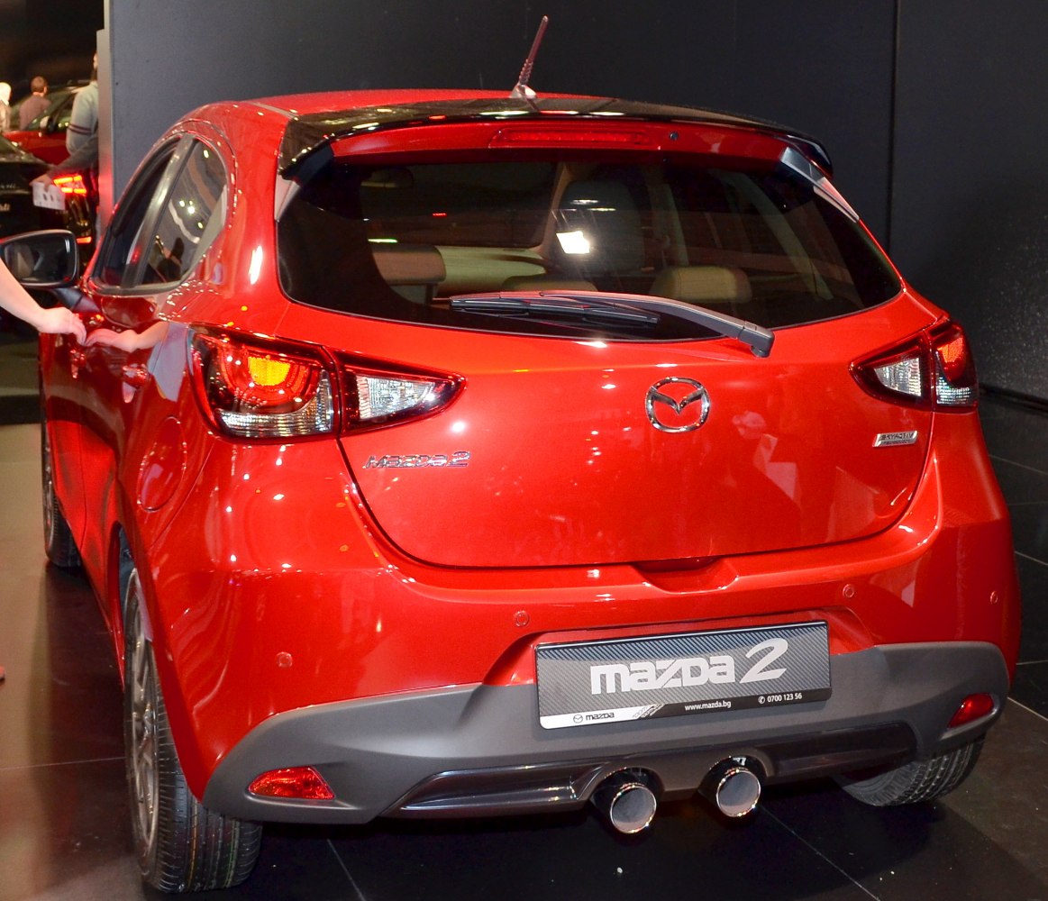 Rear hatchback with dual exhaust pipes and distinctive taillights