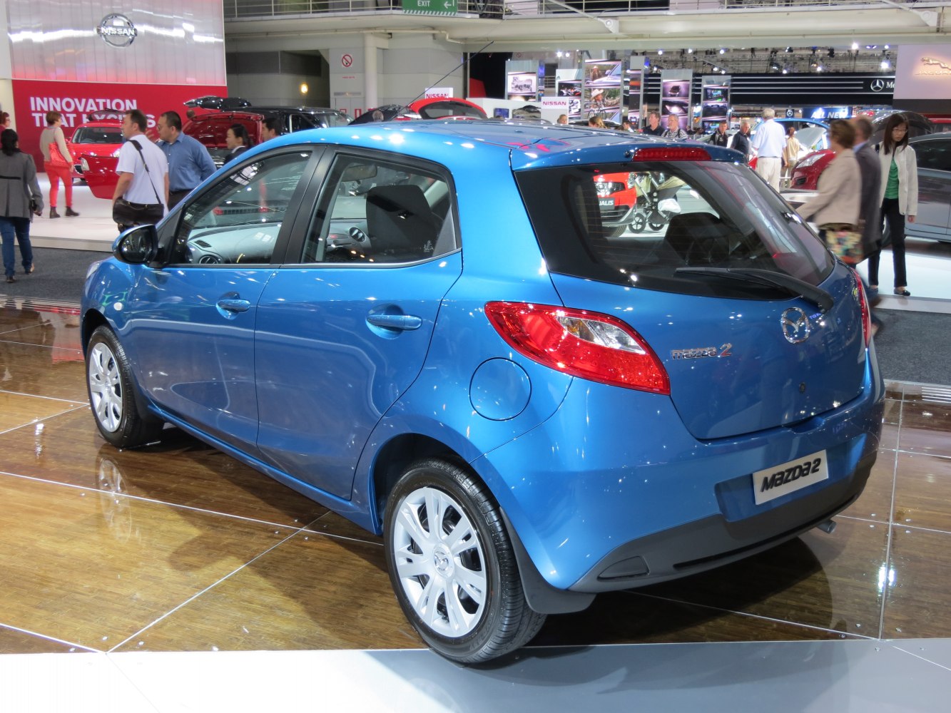 Blue compact 5-door hatchback rear side profile with modern tail lights
